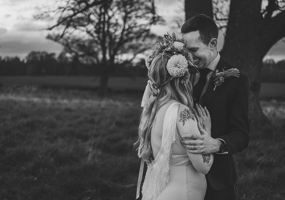 Black and white images of bride and groom embracing