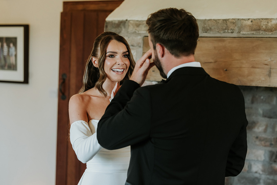 Bride comforts her groom as he cries during first look at Harelaw Farm.