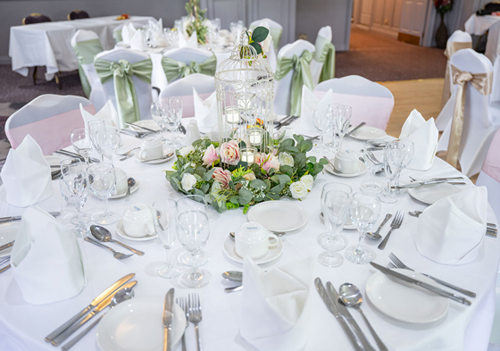 White table decor with baby pink roses