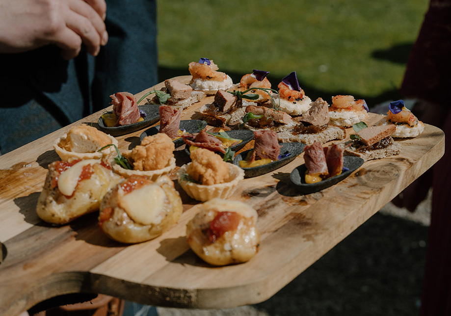 Wooden plate with fancy party food