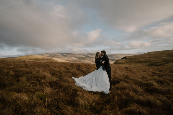 Bride and groom portrait in the Scottish hills near Auchen Castle