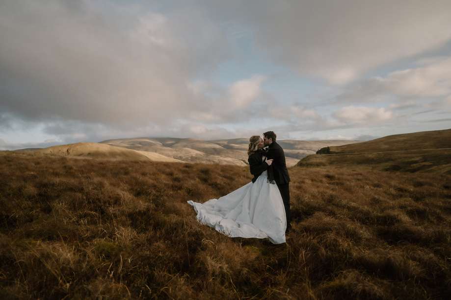Bride and groom portrait in the Scottish hills near Auchen Castle