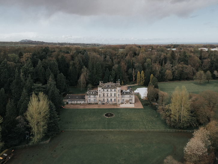 Aerial view of Melville Castle and its surrounding Scottish estate and grounds.