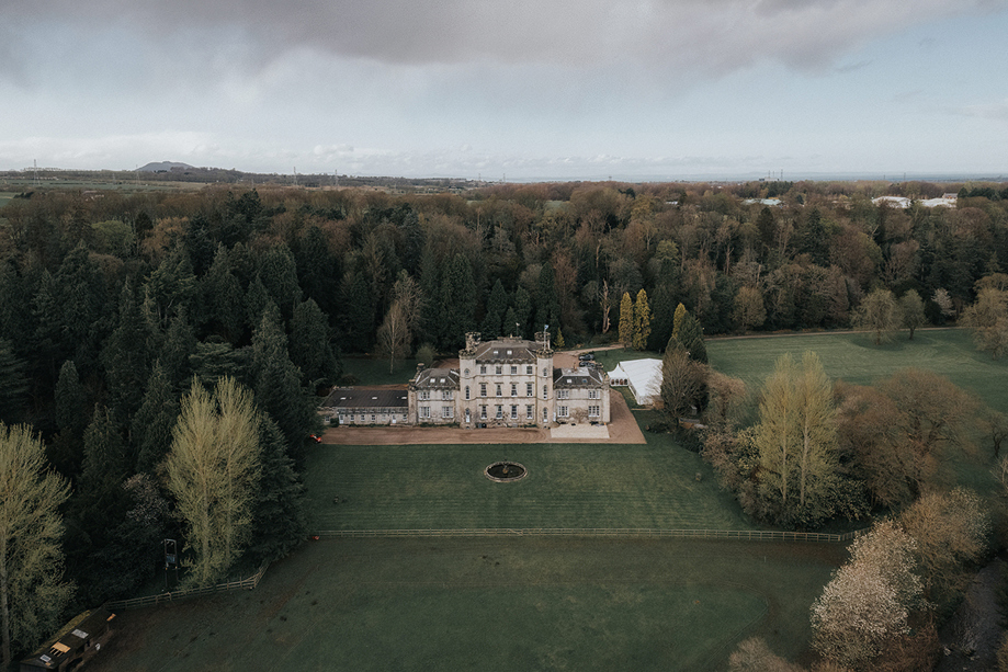 Aerial view of Melville Castle and its surrounding Scottish estate and grounds.
