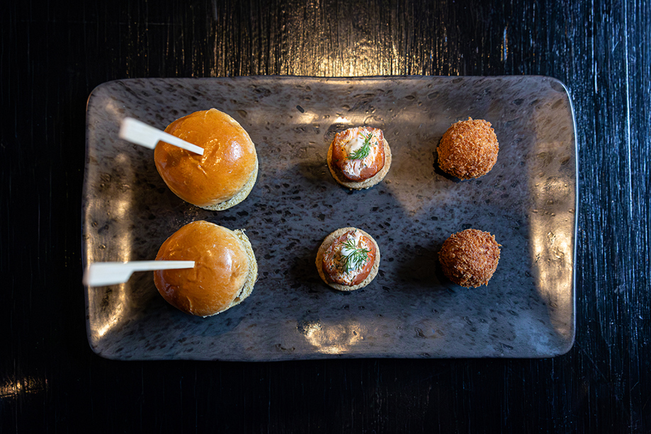Wedding canapés served on a platter at Melville Castle, including mini sliders, smoked salmon bites and crispy bites.