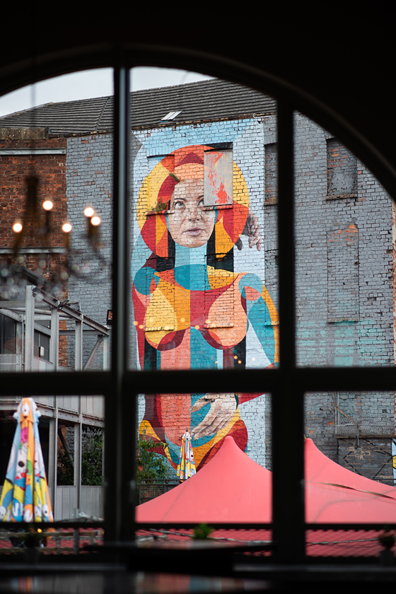 View from BAaD windows of colourful mural on wall at Barra's Art and Design.