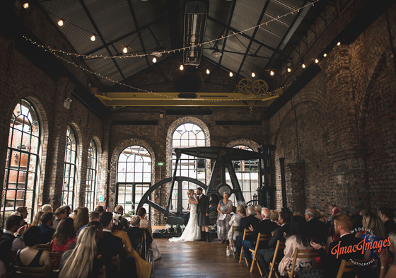 Bride and groom kiss at the altar