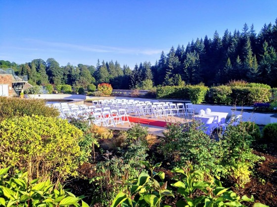 Outdoor ceremony with trees in background