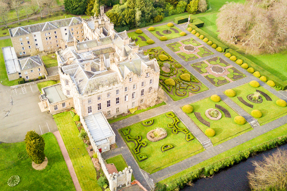 Aerial view of Newbattle Abbey College wedding venue with formal gardens and historic building in Midlothian Scotland