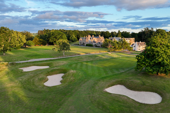 Exterior of SCHLOSS Roxburghe with grounds in view.