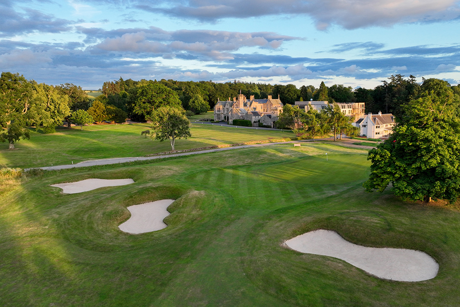 Exterior of SCHLOSS Roxburghe with grounds in view.
