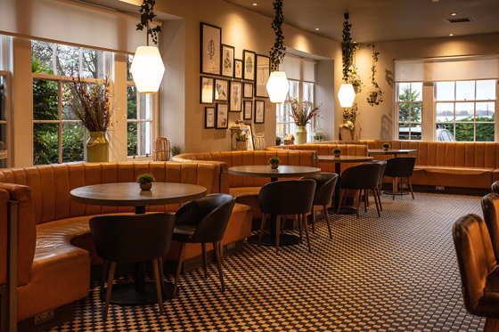 Stylish restaurant space at Strathaven Hotel with leather booth seating and modern décor for relaxed wedding dining.