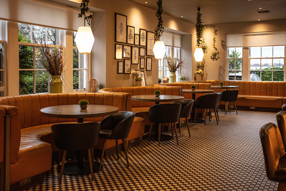 Stylish restaurant space at Strathaven Hotel with leather booth seating and modern décor for relaxed wedding dining.