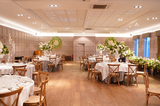 Wedding reception dining setup at Strathaven Hotel with round tables, floral centrepieces and elegant event styling.
