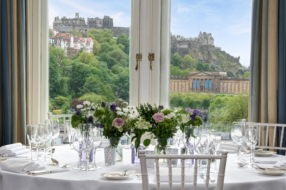 Wedding table set at The Balmoral Hotel with Edinburgh Castle view through window
