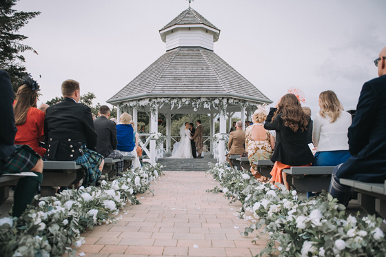 Bride and groom at altar under Pavilion