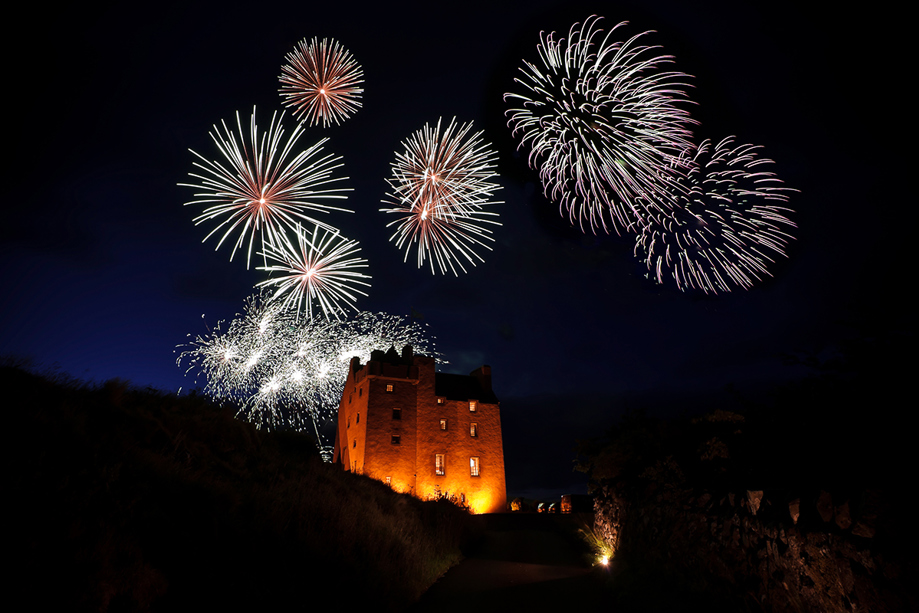 Fireworks display lighting up Fenton Tower during an evening wedding celebration