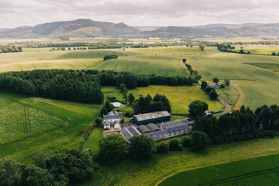 Drone view of Wed in a Shed in Perthshire with hills in background