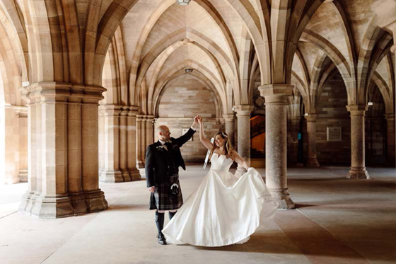Bride and groom dance in the Cloisters at the University of Glasgow.