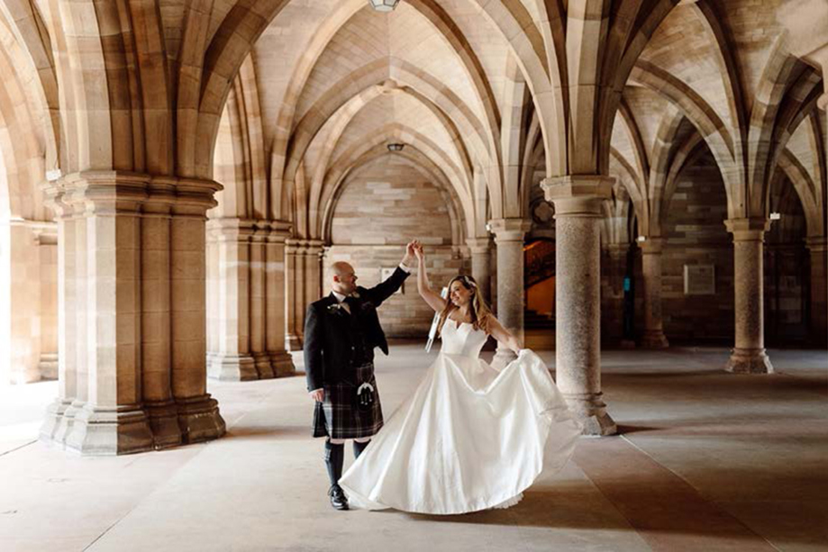 Bride and groom dance in the Cloisters at the University of Glasgow.