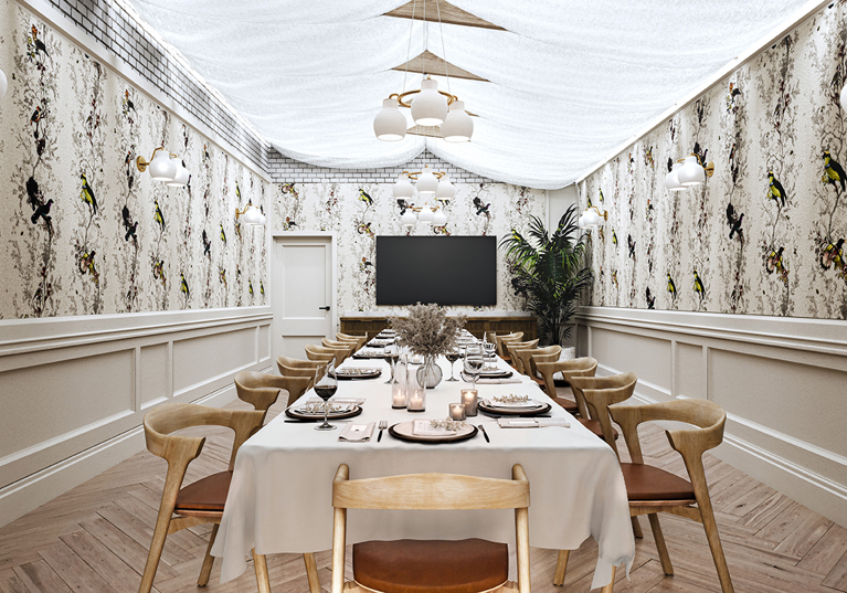 Wedding meal set up at The Collector's Hall in room with long table, wooden and maroon seats, draped ceiling with hanging lights and bird wallpaper.