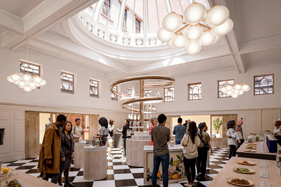 People stand beneath glass ceiling dome at The Collector's Hall, with small decorative windows and checkerboard flooring.